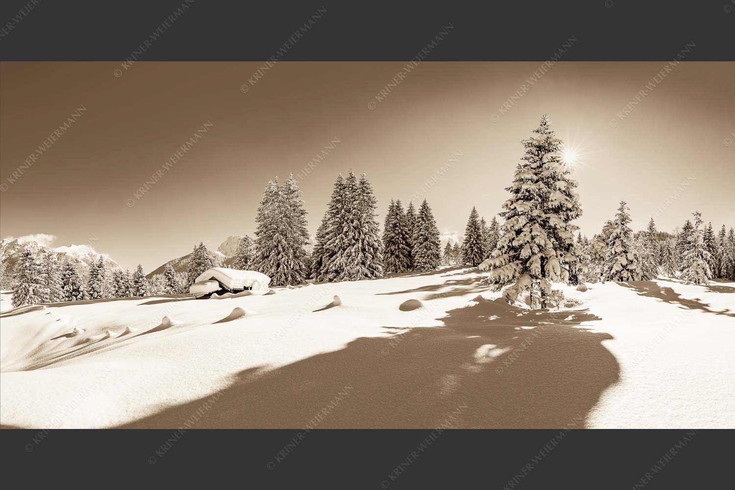 Verschneite Winterlandschaft mit Karwendel im Hintergrund - Reichlich Schnee 2:1 sepia -- Winter Wald Karwendel - mehr Infos bei www.Kriner-Weiermann.de