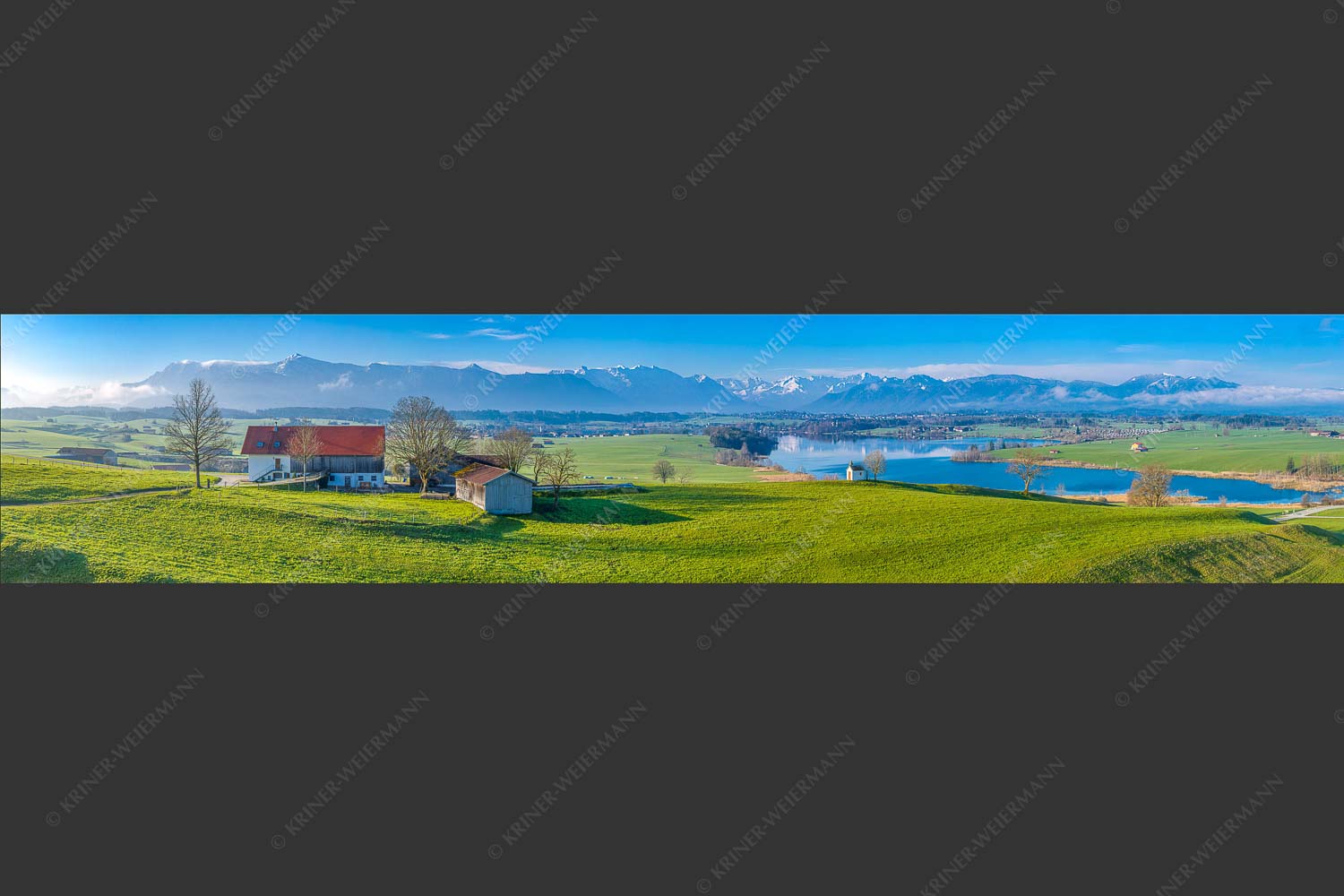 Blick über den Riegsee zum Estergebirge, Wetterstein und Ammergauer Bergen - Frühlingsgöttin Ostara 5:1  -- Mesnerhauskapelle Aidling - mehr Infos bei www.Kriner-Weiermann.de