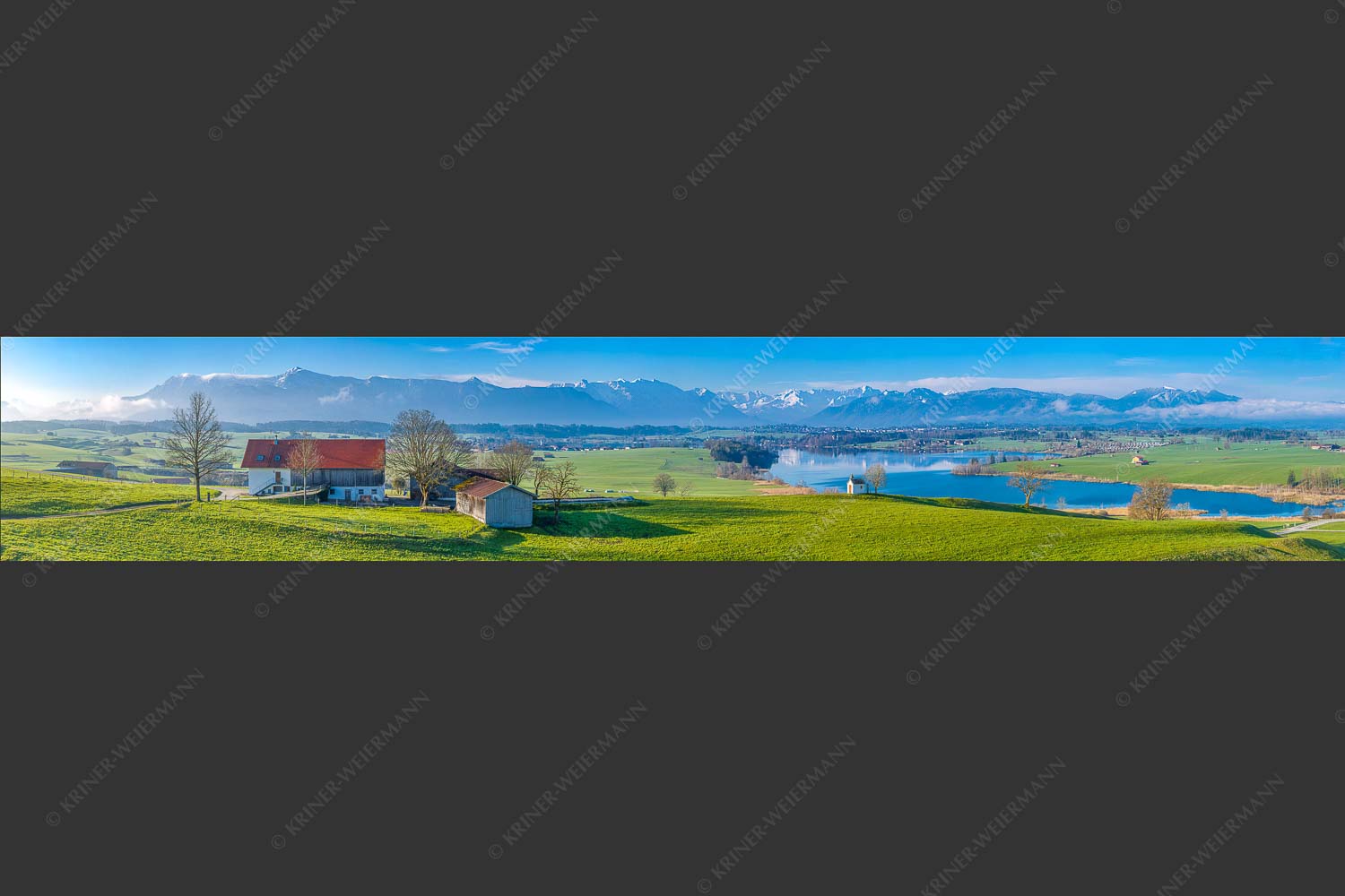Blick über den Riegsee zum Estergebirge, Wetterstein und Ammergauer Bergen - Frühlingsgöttin Ostara 6:1  -- Mesnerhauskapelle Aidling - mehr Infos bei www.Kriner-Weiermann.de